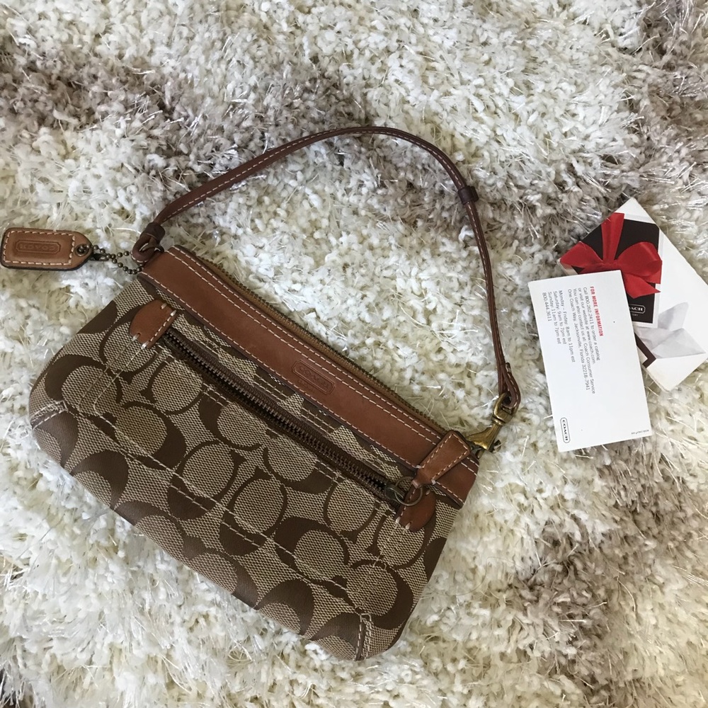 Authentic coach wristlet. Canvas with leather